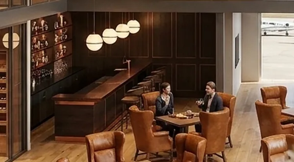 The wood and leather bar with pendant lighting